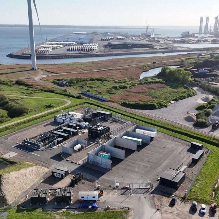 Drone photo of Måde Energy Park, Denmark, showing hydrogen facility, wind turbines, and battery storage